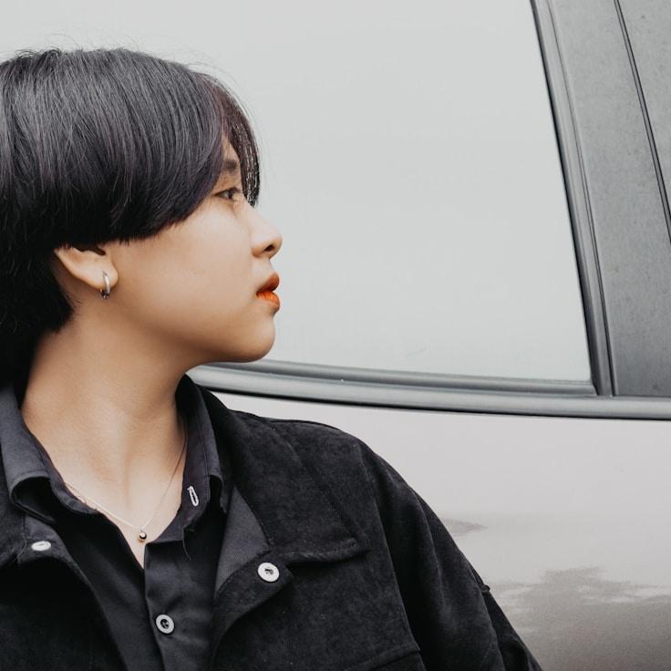 Alex Rivera, Lead Design Curator at Miravex Tundra, reviewing corporate floral arrangements